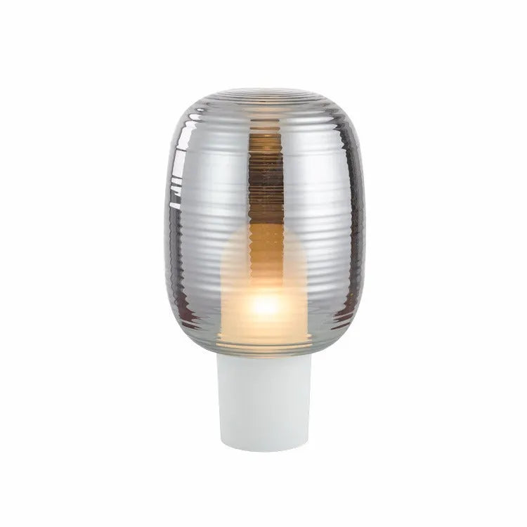 Modern glass table lamp in simple Nordic design, shown in cognac colour with push button switch.