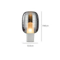 Modern glass table lamp in simple Nordic design, shown in cognac colour with push button switch.