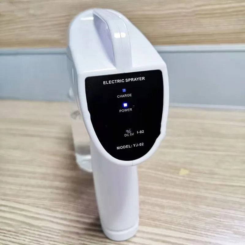White handheld cordless electric disinfection spray gun with USB charging port