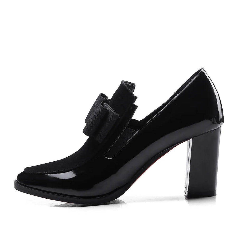 Black patent leather women's high heels with a thick square heel over 8cm high and a square toe.