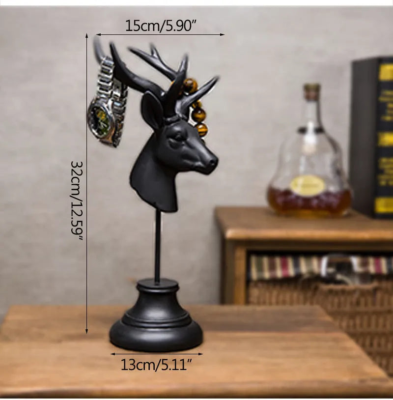 Tall black natural resin animal sculpture for home decoration on a wooden table.
