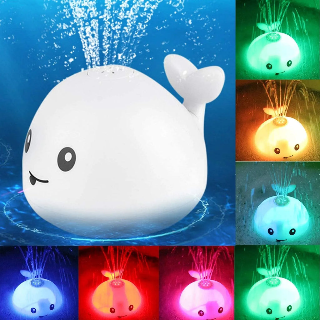 White and blue whale-shaped bath toy with water spray and LED lights floating in water