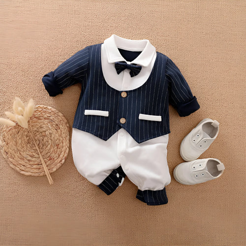 Baby boy wearing cotton gentleman-style jumpsuit in navy blue with long sleeves for spring or autumn