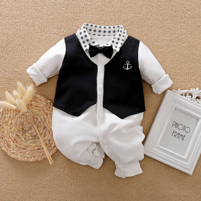 Baby boy wearing cotton gentleman-style jumpsuit in navy blue with long sleeves for spring or autumn