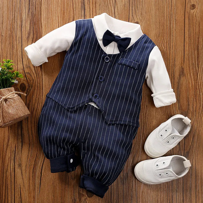 Baby boy wearing cotton gentleman-style jumpsuit in navy blue with long sleeves for spring or autumn