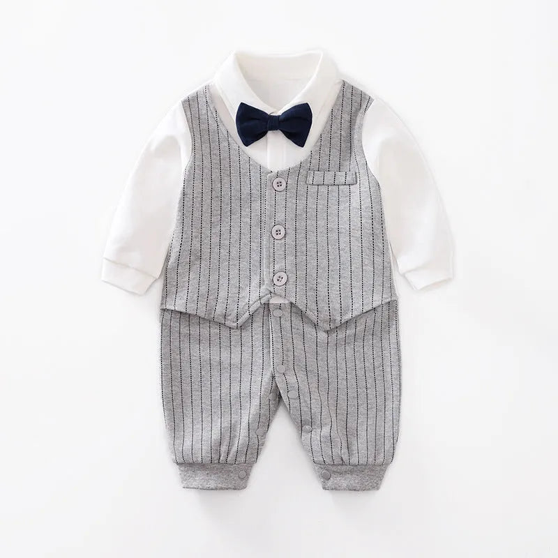 Baby boy wearing cotton gentleman-style jumpsuit in navy blue with long sleeves for spring or autumn