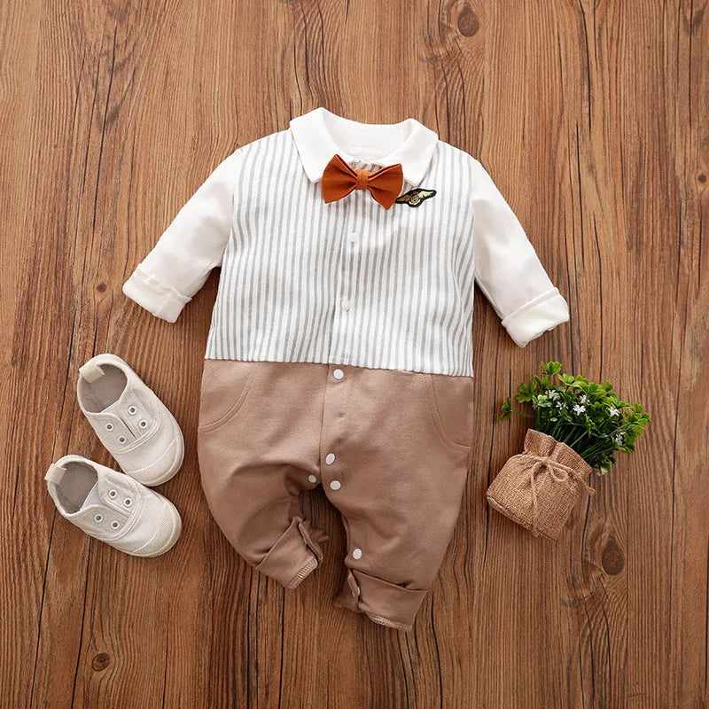 Baby boy wearing cotton gentleman-style jumpsuit in navy blue with long sleeves for spring or autumn