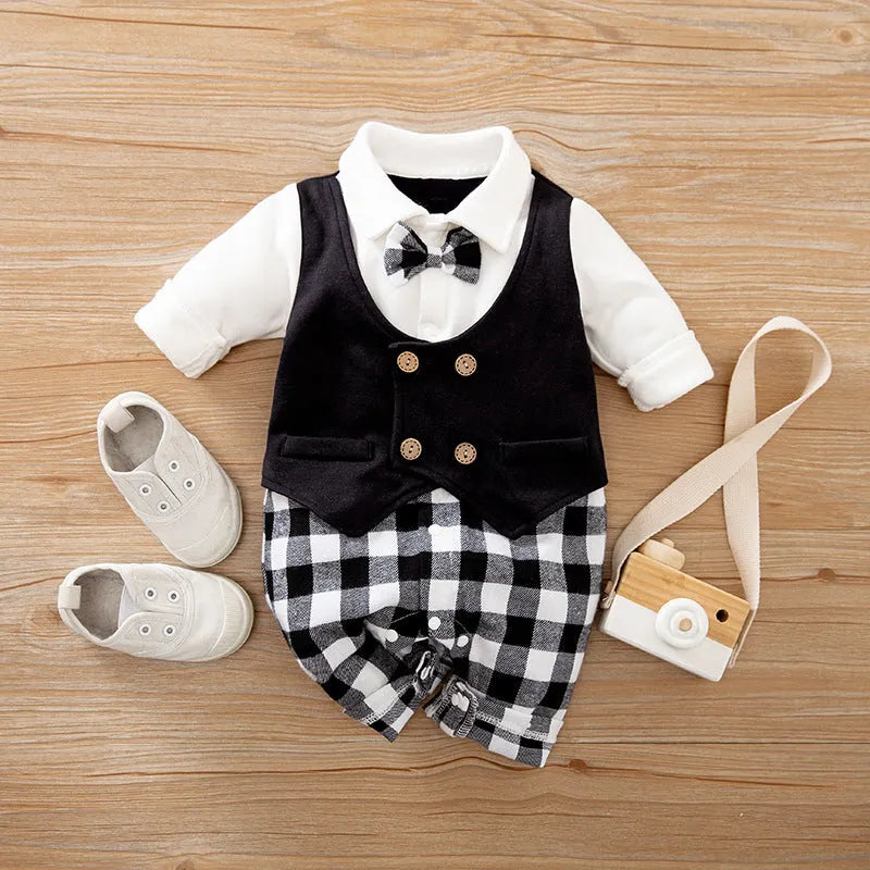 Baby boy wearing cotton gentleman-style jumpsuit in navy blue with long sleeves for spring or autumn