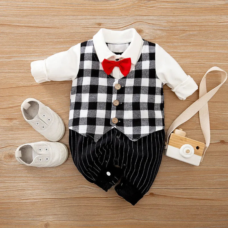 Baby boy wearing cotton gentleman-style jumpsuit in navy blue with long sleeves for spring or autumn