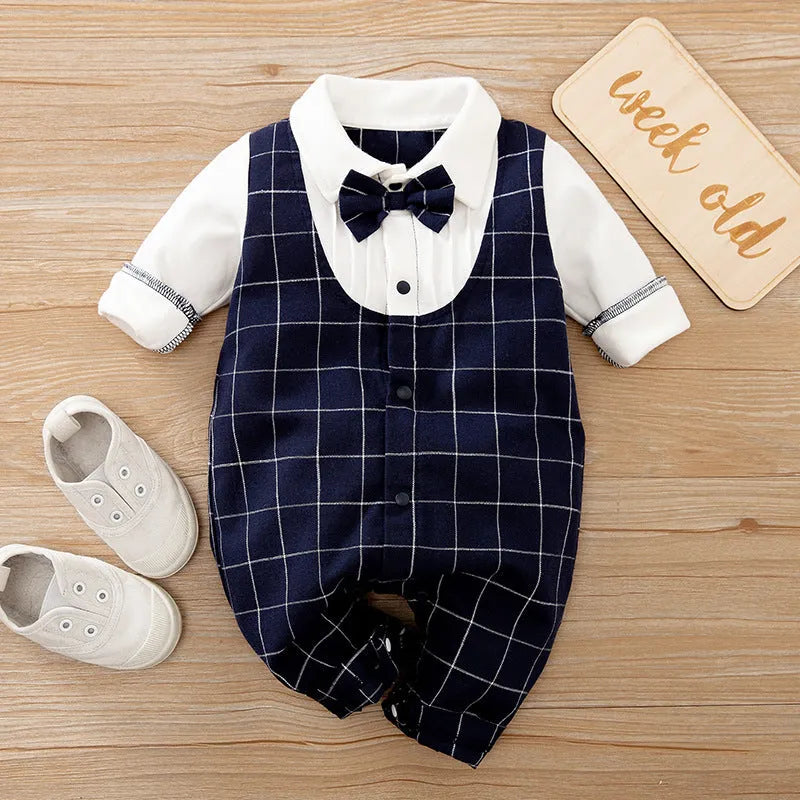 Baby boy wearing cotton gentleman-style jumpsuit in navy blue with long sleeves for spring or autumn