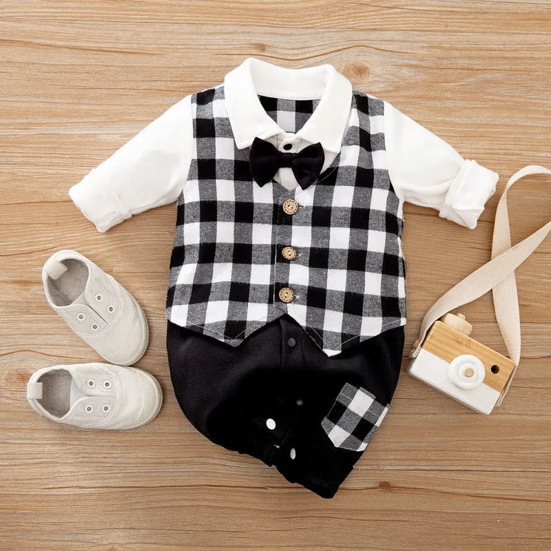 Baby boy wearing cotton gentleman-style jumpsuit in navy blue with long sleeves for spring or autumn