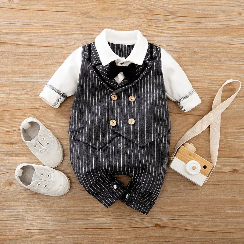 Baby boy wearing cotton gentleman-style jumpsuit in navy blue with long sleeves for spring or autumn