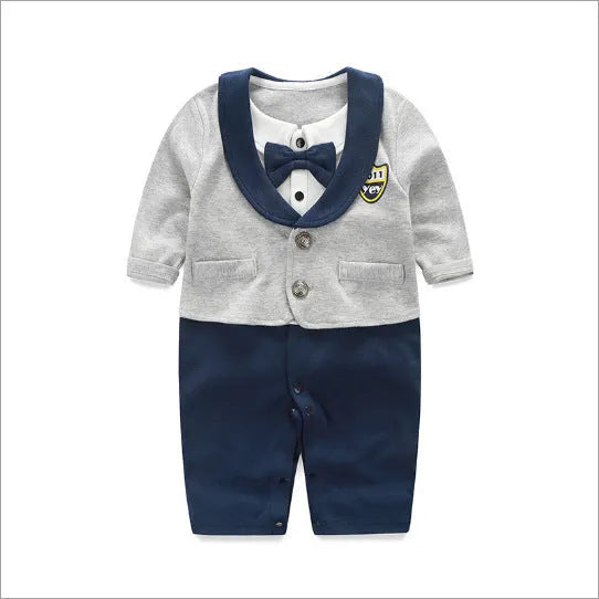Baby boy wearing cotton gentleman-style jumpsuit in navy blue with long sleeves for spring or autumn