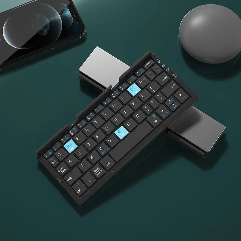 Silver white aluminium folding Bluetooth keyboard open with smartphone propped on hidden stand
