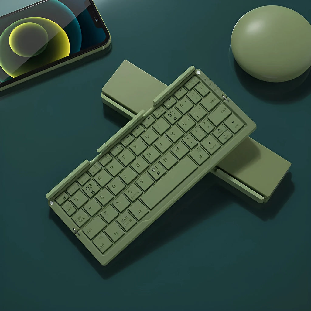 Silver white aluminium folding Bluetooth keyboard open with smartphone propped on hidden stand