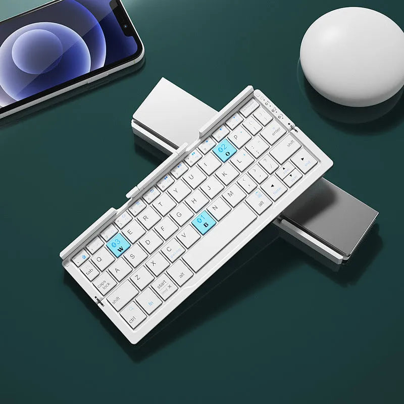 Silver white aluminium folding Bluetooth keyboard open with smartphone propped on hidden stand