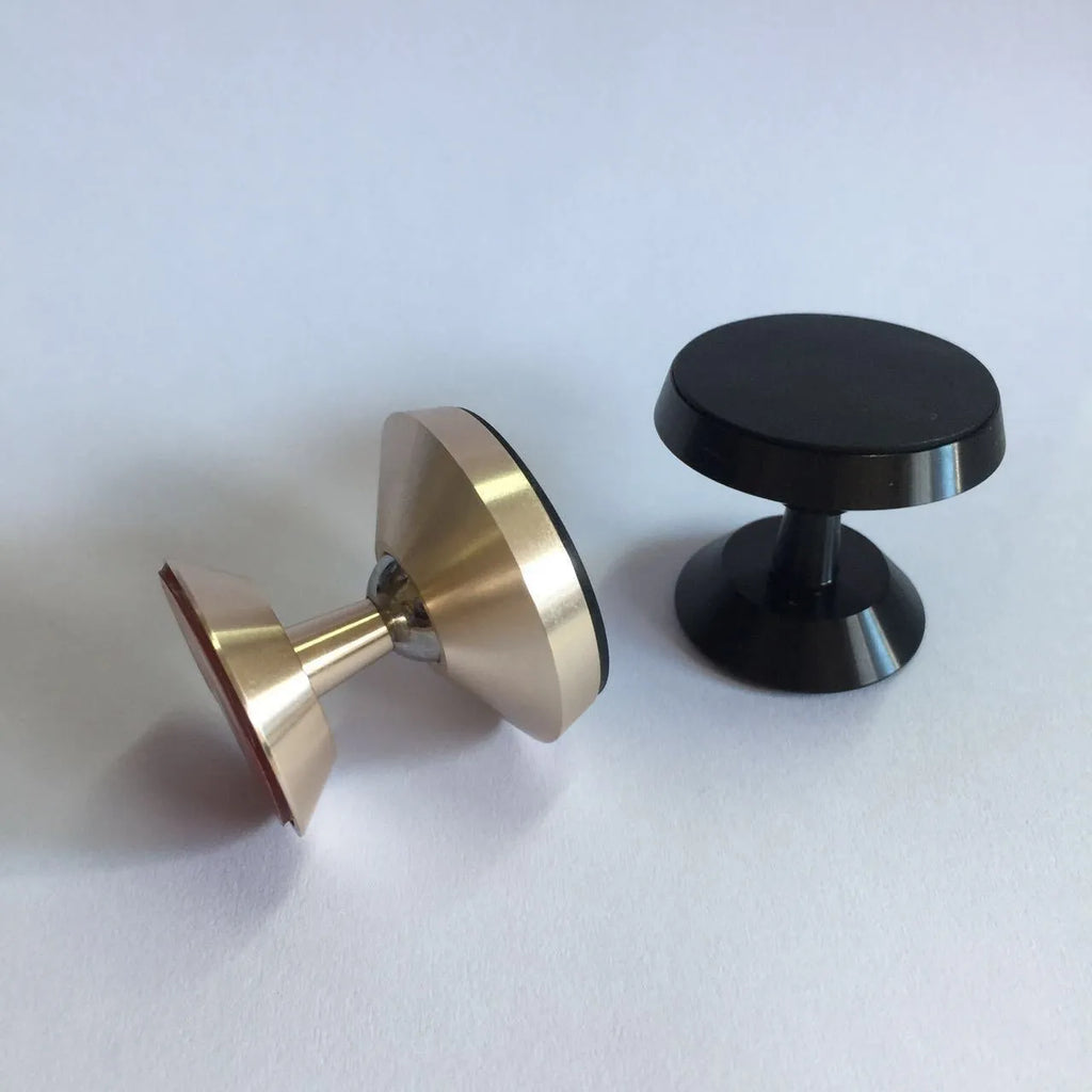 Magnetic car air outlet phone bracket in black attached to a vehicle vent
