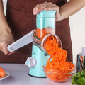 Multi-function kitchen roller gadget with vegetable chopper and suction cup base in blue colour