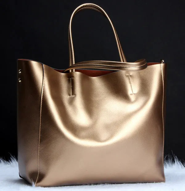 Women's cowhide leather shoulder bag showing silver, bronze, wine red, blue, and black colour options