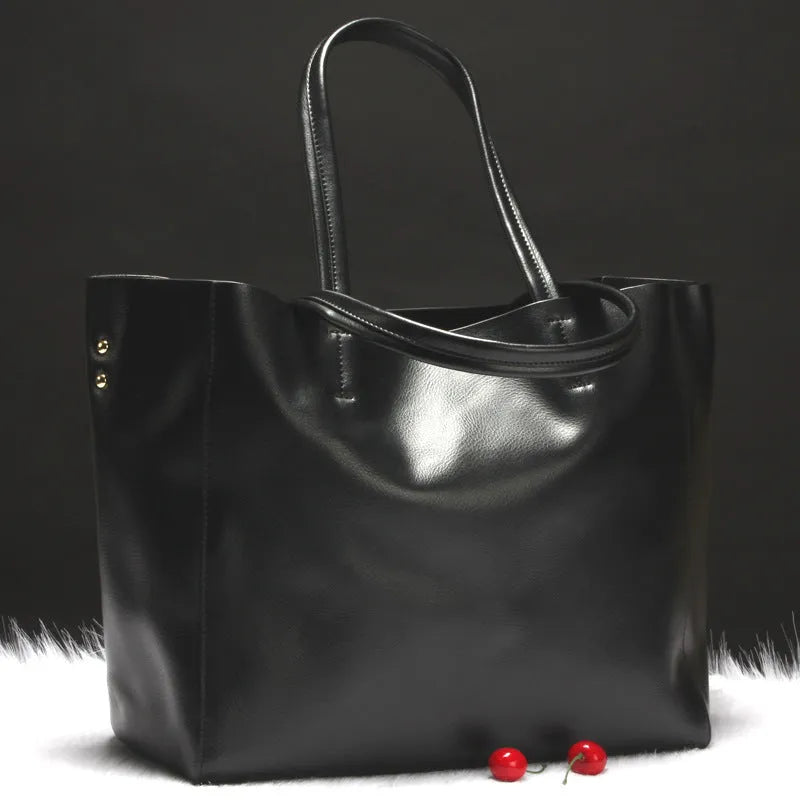 Women's cowhide leather shoulder bag showing silver, bronze, wine red, blue, and black colour options