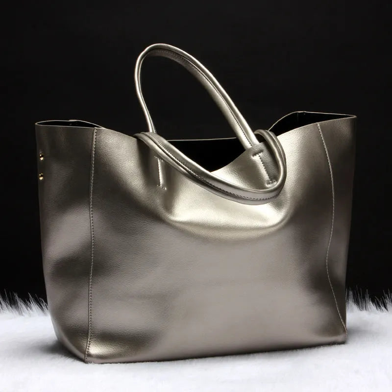 Women's cowhide leather shoulder bag showing silver, bronze, wine red, blue, and black colour options