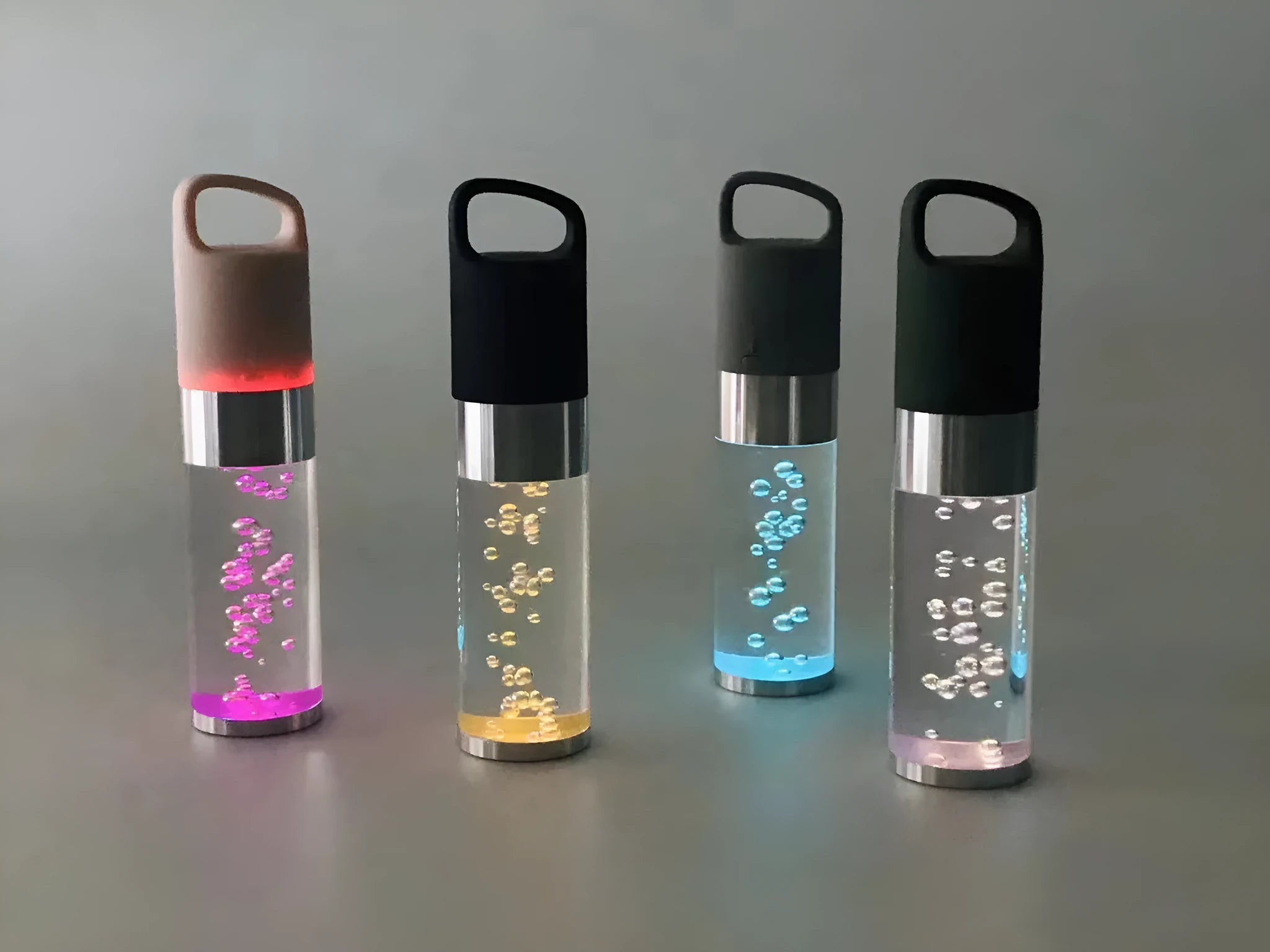 Pink portable Bluetooth speaker with colourful cartoon crystal LED lights on display.