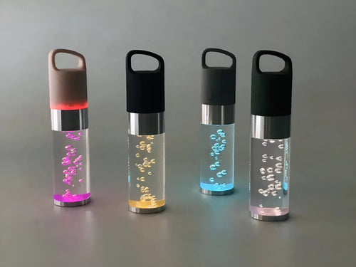 Pink portable Bluetooth speaker with colourful cartoon crystal LED lights on display.