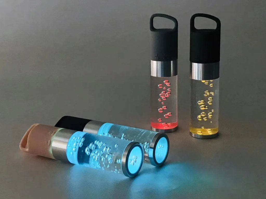 Pink portable Bluetooth speaker with colourful cartoon crystal LED lights on display.