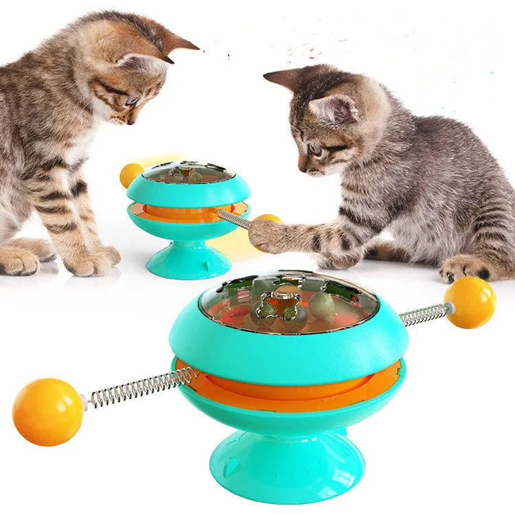 Rotatable cat toy with turntable, three catnip balls, and suction cup base in lake blue colour