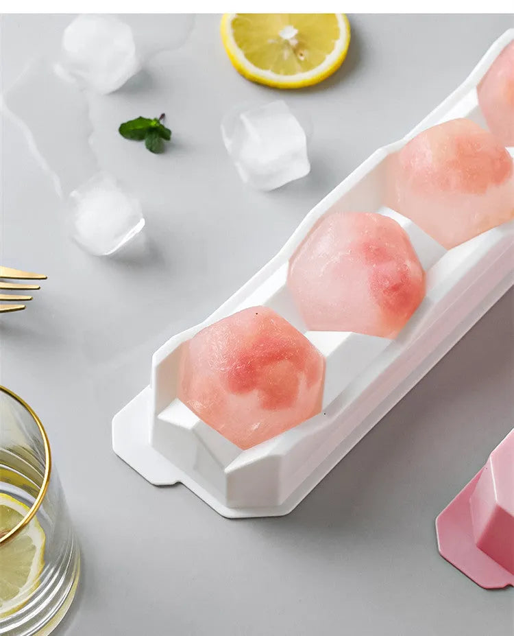Silicone ice tray showing large ice hockey shape and round ice moulds in assorted colours