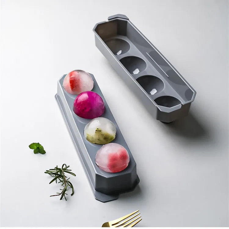 Silicone ice tray showing large ice hockey shape and round ice moulds in assorted colours