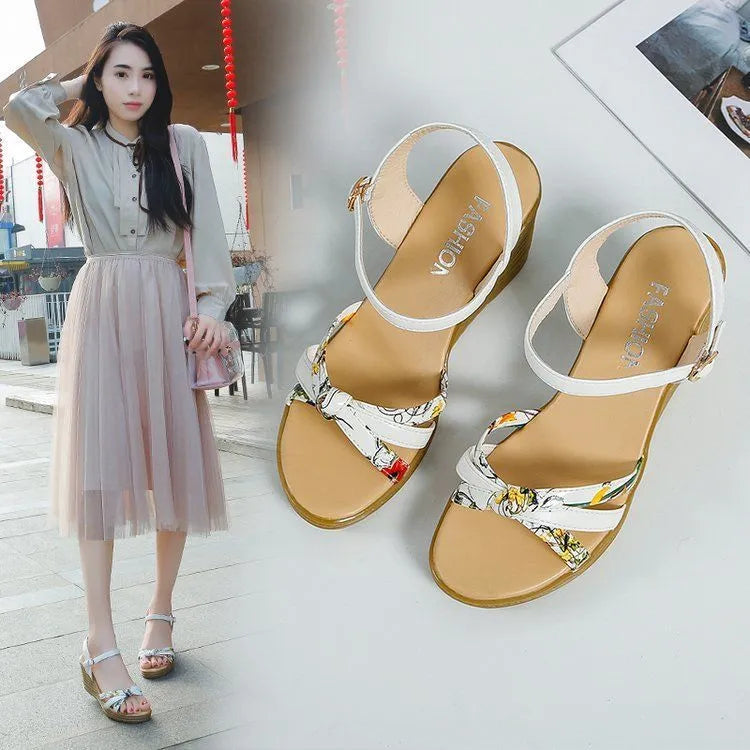 Women's pink wedge sandals with a thick heel, fish mouth toe, and a silver buckle closure on a waterproof platform sole.
