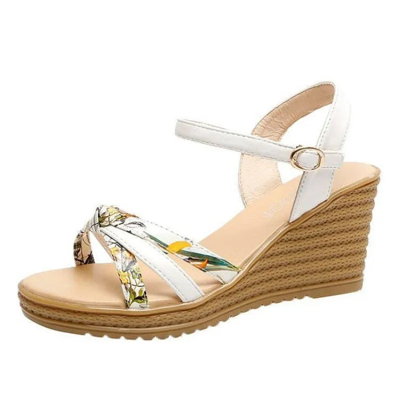 Women's pink wedge sandals with a thick heel, fish mouth toe, and a silver buckle closure on a waterproof platform sole.