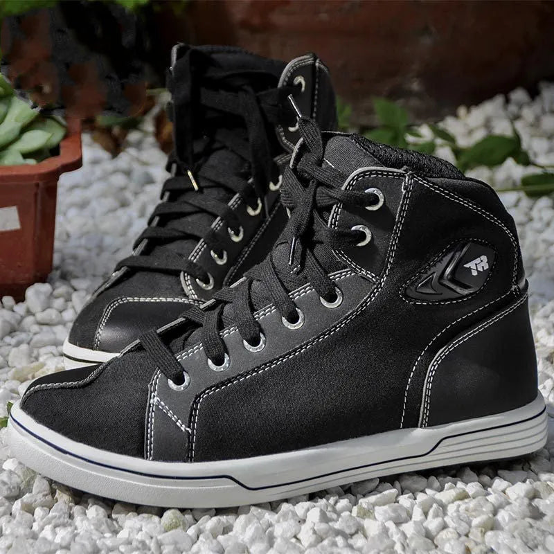 Black and grey motorcycle riding shoes showing casual short boot design with anti-slip soles
