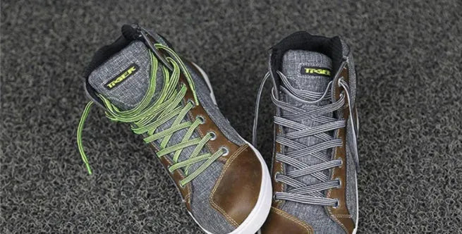 Black and grey motorcycle riding shoes showing casual short boot design with anti-slip soles