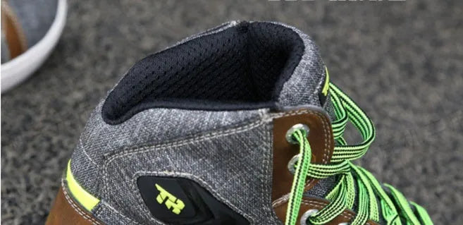 Black and grey motorcycle riding shoes showing casual short boot design with anti-slip soles