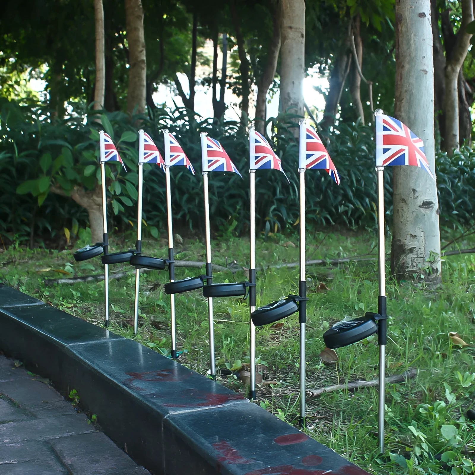 Solar-powered garden flag light with stainless steel frame showing American flag design
