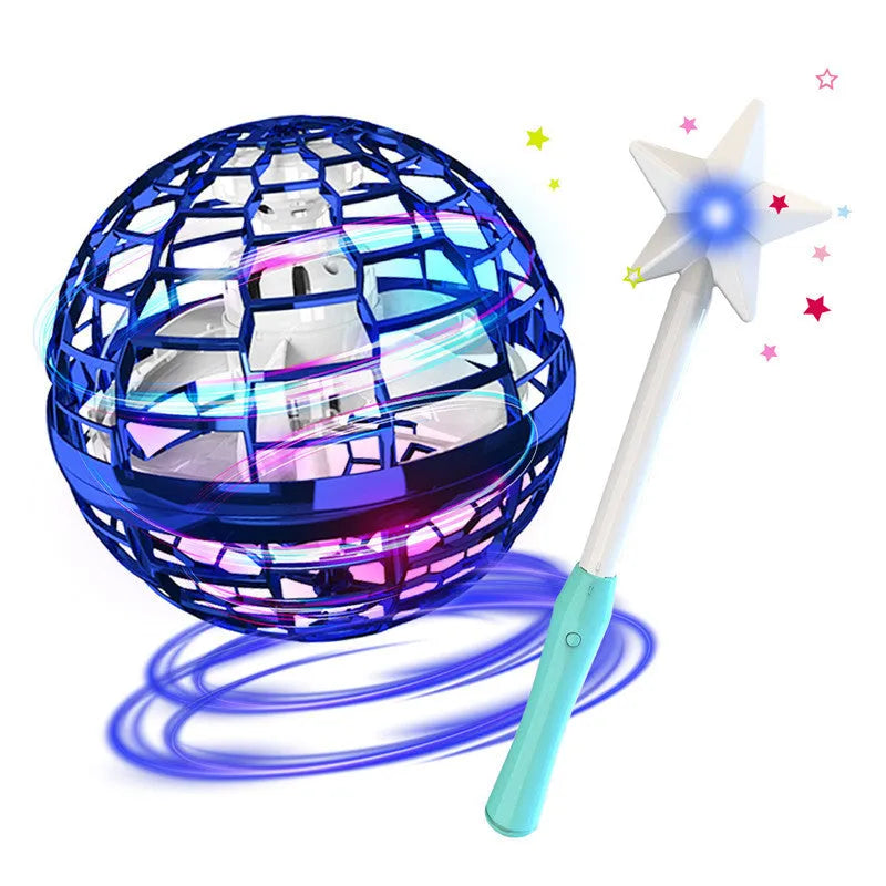Blue spinning flying ball toy with LED lights hovering above a child's hand next to a magic wand.