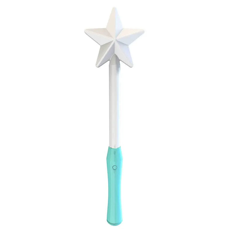 Blue spinning flying ball toy with LED lights hovering above a child's hand next to a magic wand.
