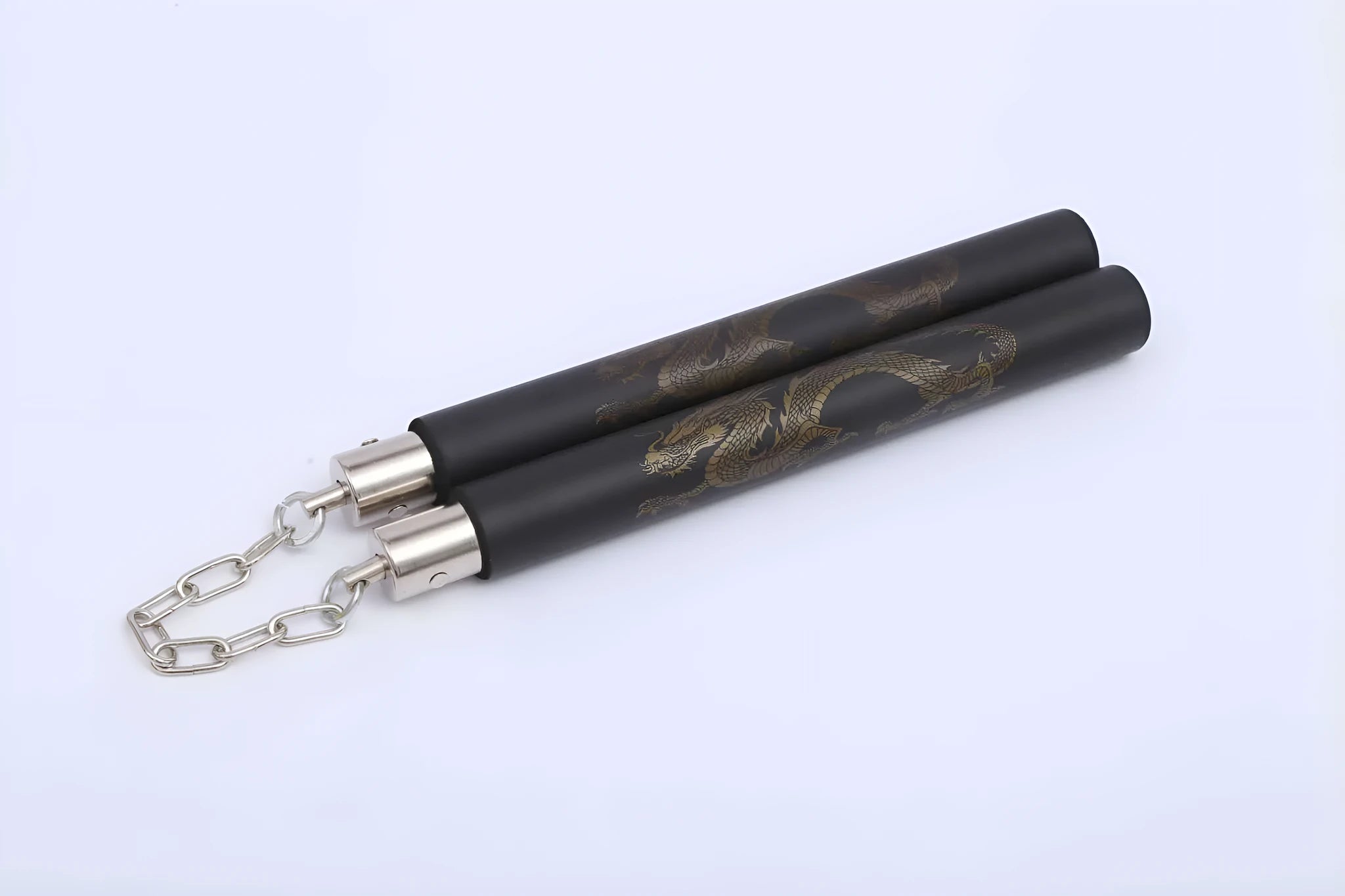 Red foam-covered training nunchakus with 28cm sticks connected by metal chain for martial arts practice