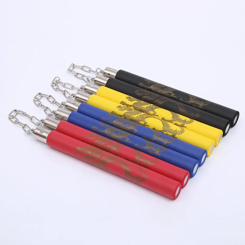 Red foam-covered training nunchakus with 28cm sticks connected by metal chain for martial arts practice