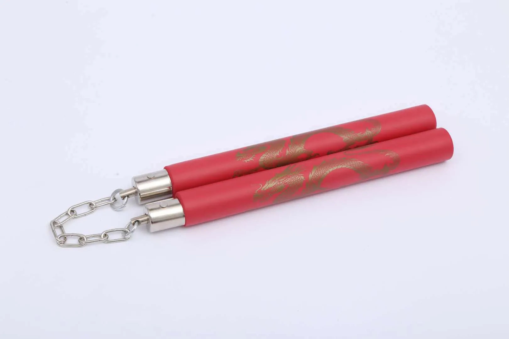 Red foam-covered training nunchakus with 28cm sticks connected by metal chain for martial arts practice