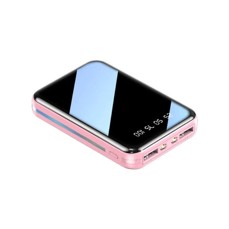 Mini digital display power bank in plastic shell showing capacity readout.