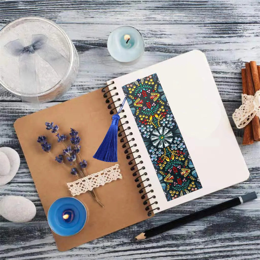 Handcrafted leather bookmark with a diamond-embroidered mandala flower design.