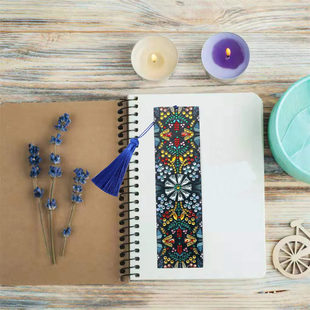 Handcrafted leather bookmark with a diamond-embroidered mandala flower design.
