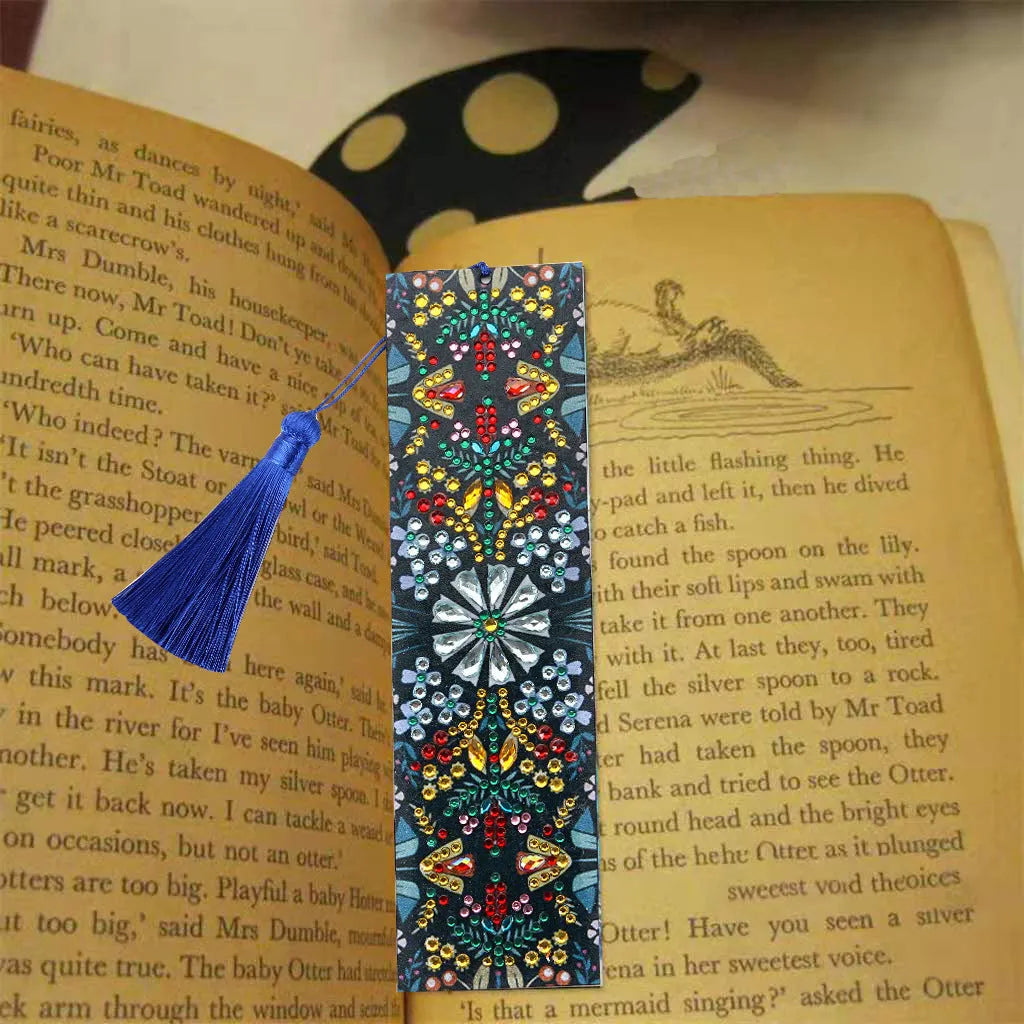 Handcrafted leather bookmark with a diamond-embroidered mandala flower design.