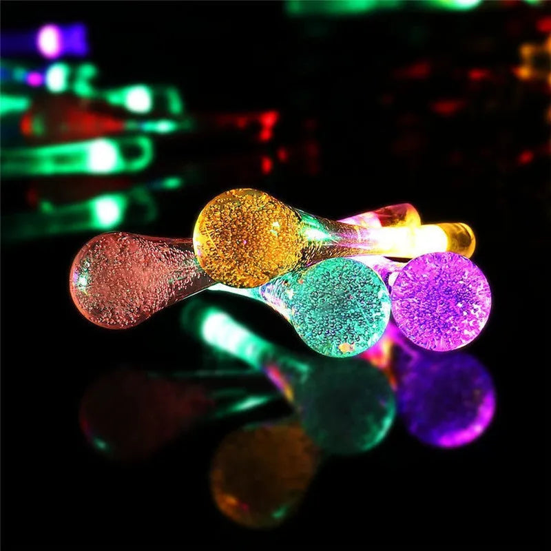 Solar-powered LED water drops string lights with 30 bulbs on 6.5 metre waterproof cable for outdoor garden use