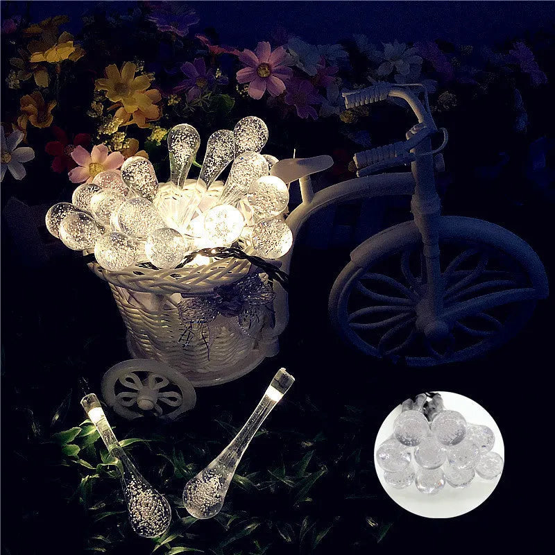 Solar-powered LED water drops string lights with 30 bulbs on 6.5 metre waterproof cable for outdoor garden use