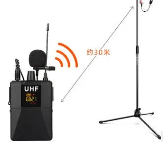 Black Little Bee wireless lavalier microphone clipped to a shirt collar next to its receiver.