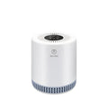 White indoor household air purifier unit with HEPA filter element.